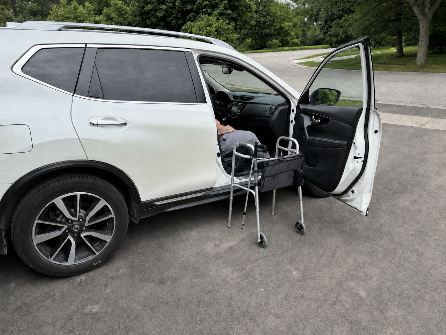 Walker positioned beside an open passenger door as I prepare to get in or out of the car during hip replacement recovery.